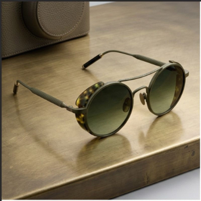 Frame Style 2 in vintage bronze beta titanium on a brass table