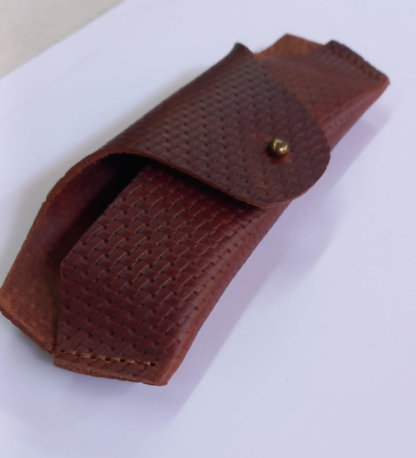 Hand-burnished leather Moonshades case with a brass stud closure